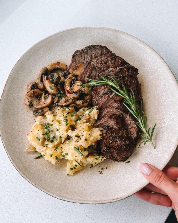 Thin Sliced Sirloin Tip Steak with Roasted Garlic Mashed Potatoes