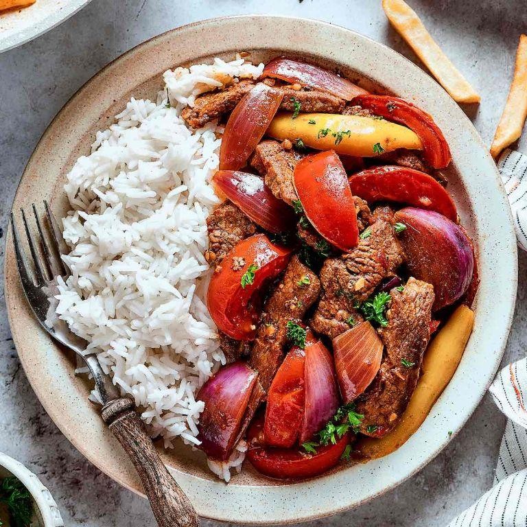 Lomo Saltado Stuffed Peppers with a Side of Rice